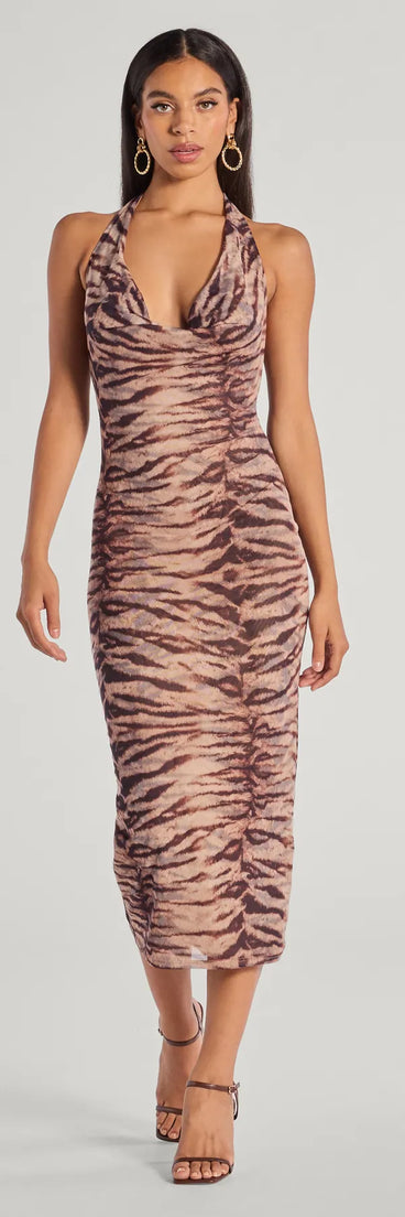 With its mid-calf hem and popular flattering fit, the Sultry And Sassy Zebra Print Halter Midi Dress in brown nails the balance of trend and ease, redefining go-to midi dresses for any occasion.