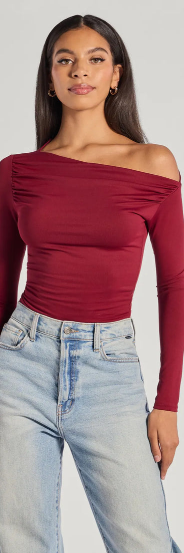 The Chic Showstopper Off-The-Shoulder Top in wine with a modern design and trendy look is part of the latest women's tops collection to elevate your 2025 wardrobe.