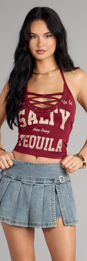 This trendy top is perfect for layering or standing out solo—your go-to piece for holiday attire, NYE party outfits, or easy celebration-ready styling in the Salt And Shots Lace-Up Graphic Halter Top .