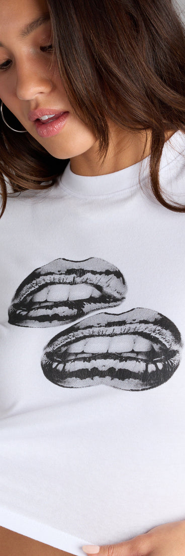 This trendy top is perfect for layering or standing out solo—your go-to piece for party outfits or easy celebration-ready styling in the Kiss Me Twice Graphic Baby Tee .