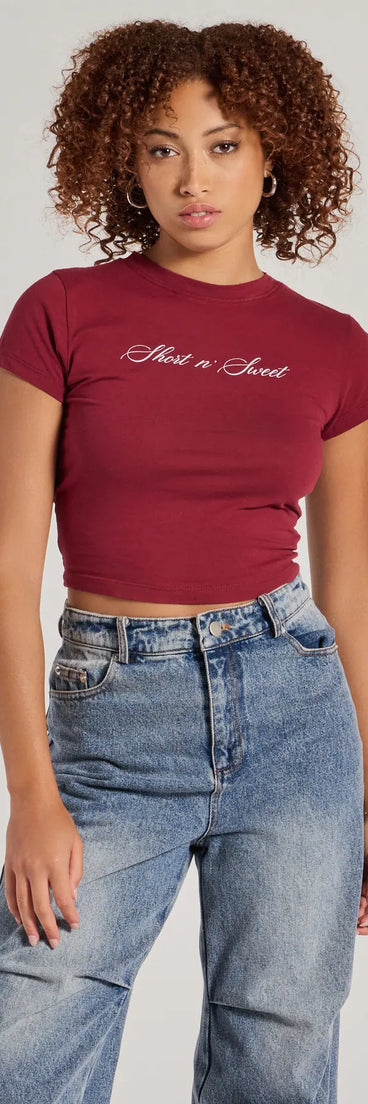 The Short n' Sweet Cropped Graphic Tee in burgundy with a modern design and trendy look is part of the latest women's tops collection to elevate your 2025 wardrobe.