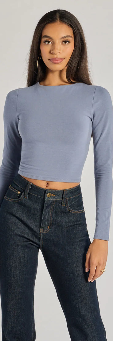 The Elevated Staple Open Back Long Sleeve Top in blue with a modern design and trendy look is part of the latest women's tops collection to elevate your 2025 wardrobe.