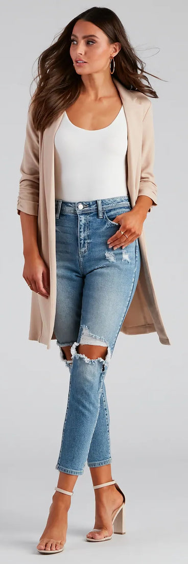 The High-Rise Distressed Mom Skinny Jeans is a trendy women's bottom in medium denim wash, designed with modern details and alluring textures to complete chic outfits for 2026.